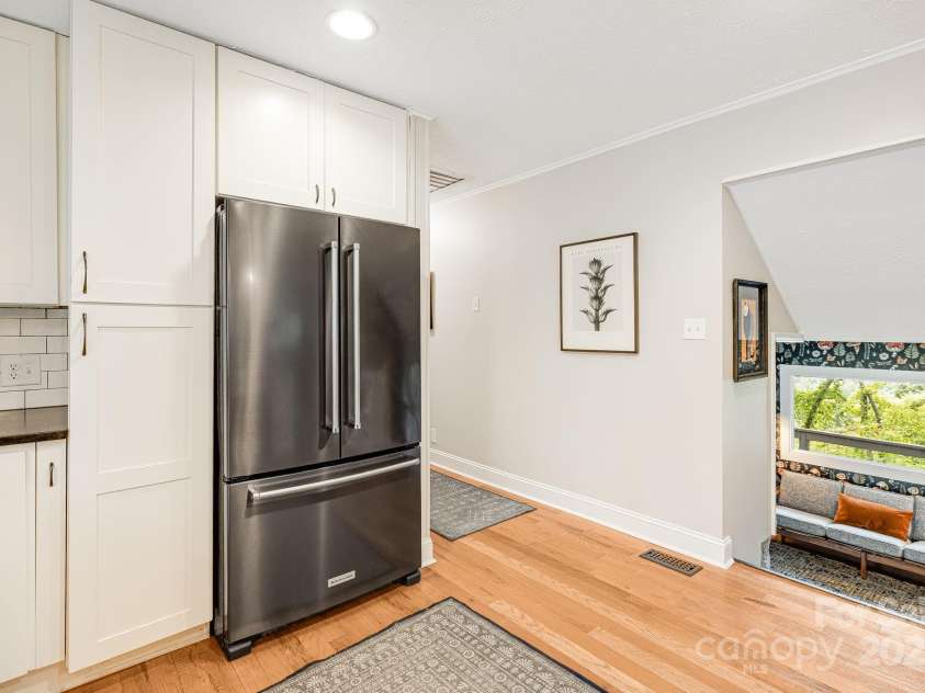 90 Reed Road, Asheville, NC 28805.  MLS# CAR4271385, YatesRealty ID 21485. Pantry Cabinet *Kitchen Flows to Den