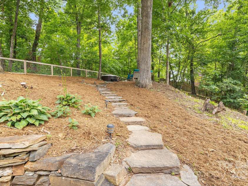 90 Reed Road, Asheville, NC 28805.  MLS# CAR4271385, YatesRealty ID 21485. Stone Path Leads to Hot Tub and Firepit