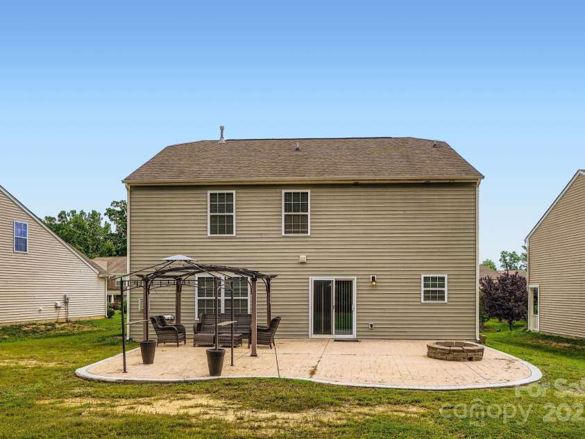 4151 Granite Street, Midland, NC 28107.  MLS# CAR4269679, YatesRealty ID 21486. Back of home ready for your design!