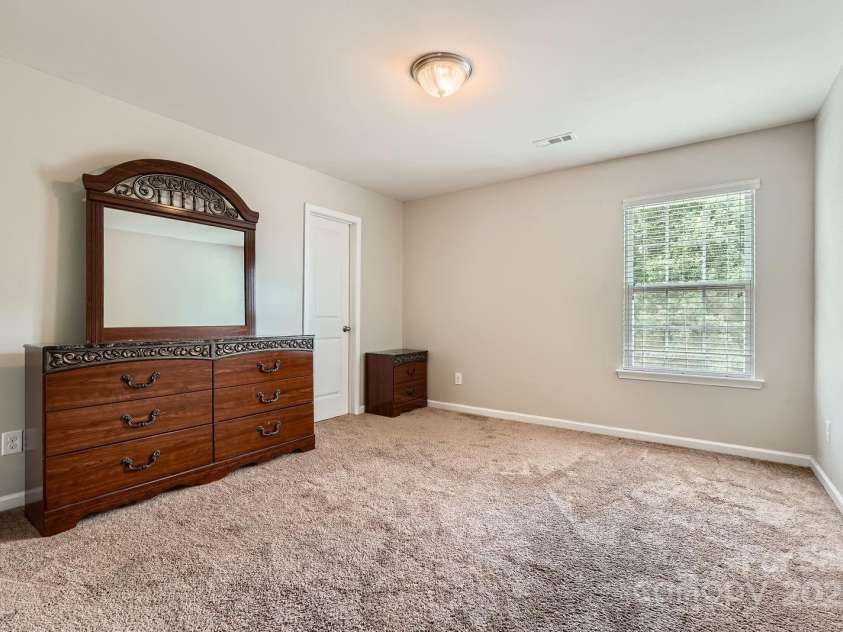 4151 Granite Street, Midland, NC 28107.  MLS# CAR4269679, YatesRealty ID 21486. Second bedroom w/ walk-in closet & door to full bath