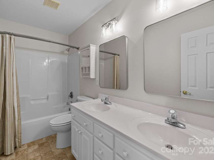 2608 Carmarthen Court, Matthews, NC 28104.  MLS# CAR4252626, YatesRealty ID 21488. Hall Bath with two sinks