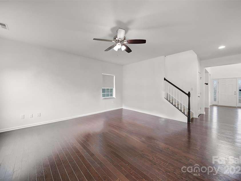 9029 Woodview Court, Fort Mill, SC 29707.  MLS# CAR4303273, YatesRealty ID 21492. Spacious Living Room Featuring a Cozy Fireplace