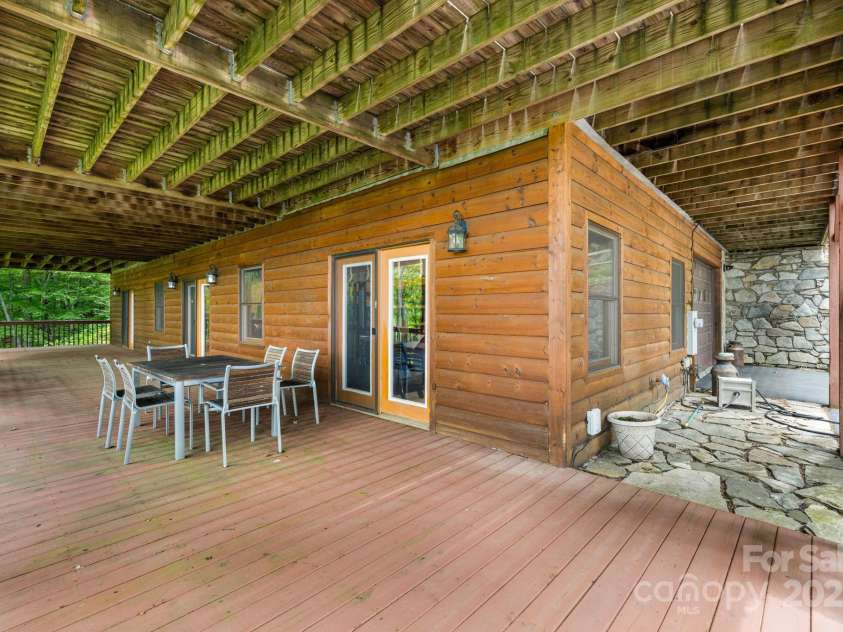 587 Grouse Thicket Road, Mars Hill, NC 28754.  MLS# CAR4269206, YatesRealty ID 21495. Lower deck to garage entry