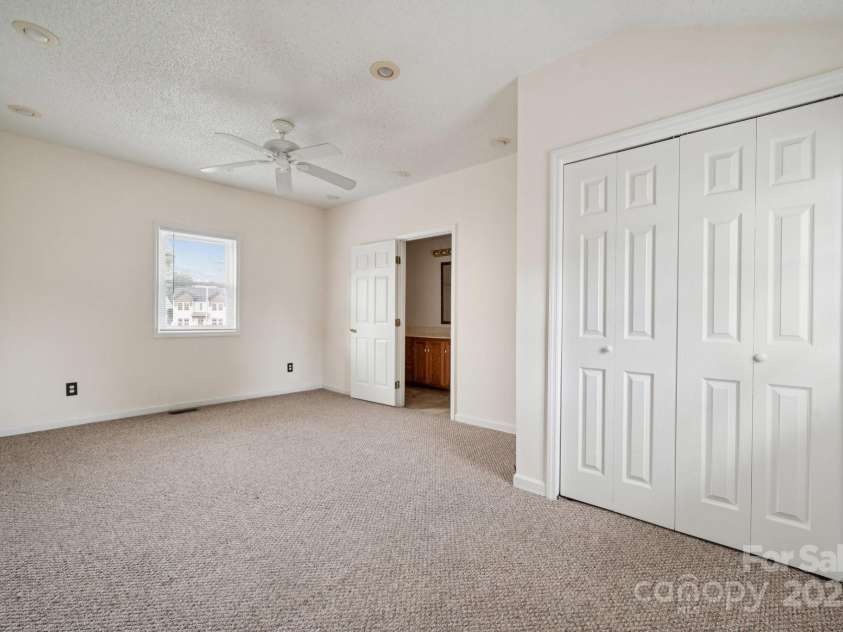 411 Central Avenue, Landis, NC 28088.  MLS# CAR4273594, YatesRealty ID 21497. Primary Bedroom w/ Primary Bathroom & Walk-in Closet