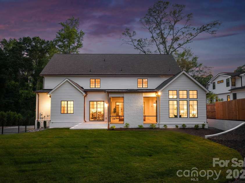 444 Hunter Lane, Charlotte, NC 28211.  MLS# CAR4405254, YatesRealty ID 21498. Rear view at twilight.