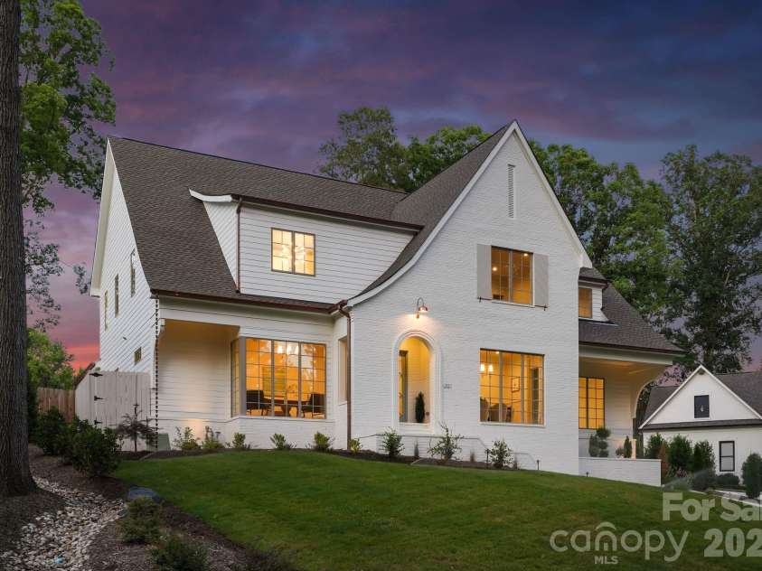444 Hunter Lane, Charlotte, NC 28211.  MLS# CAR4405254, YatesRealty ID 21498. Side view at twilight.