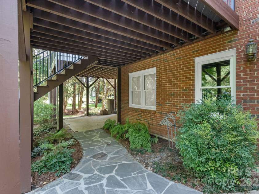 8900 Cumbria Court, Huntersville, NC 28078.  MLS# CAR4271848, YatesRealty ID 21500. Really Nice Stone Walkway leads to the stunning backyard or access to the upper deck and 3 seasons room.