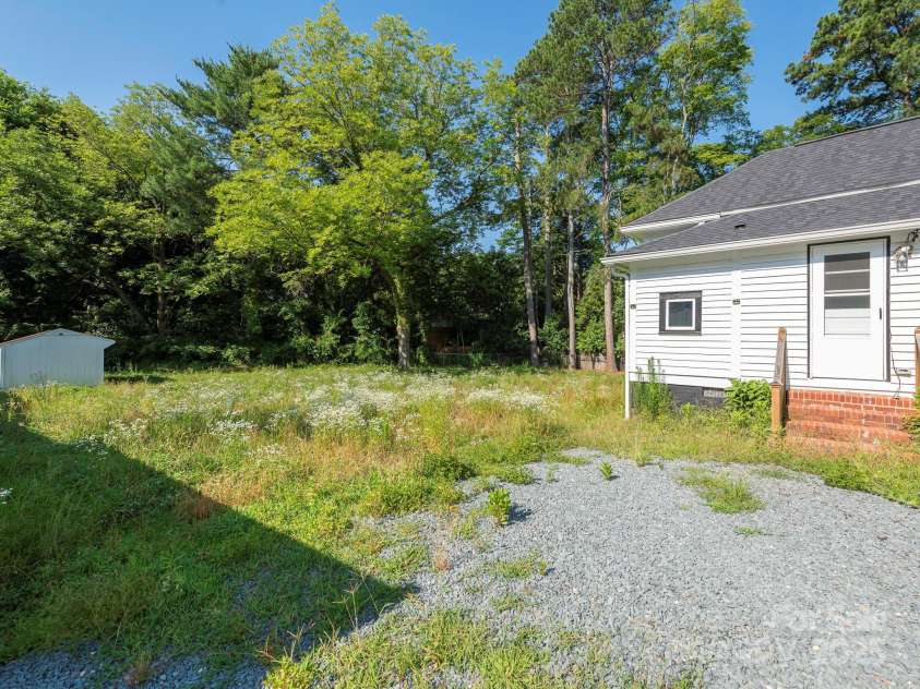 110 College Street, Marshville, NC 28103.  MLS# CAR4273371, YatesRealty ID 21502. Side Yard