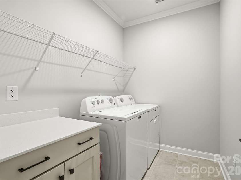 5562 Caneel Lane, Denver, NC 28037.  MLS# CAR4365008, YatesRealty ID 21504. LARGE laundry room with folding station and cabinets