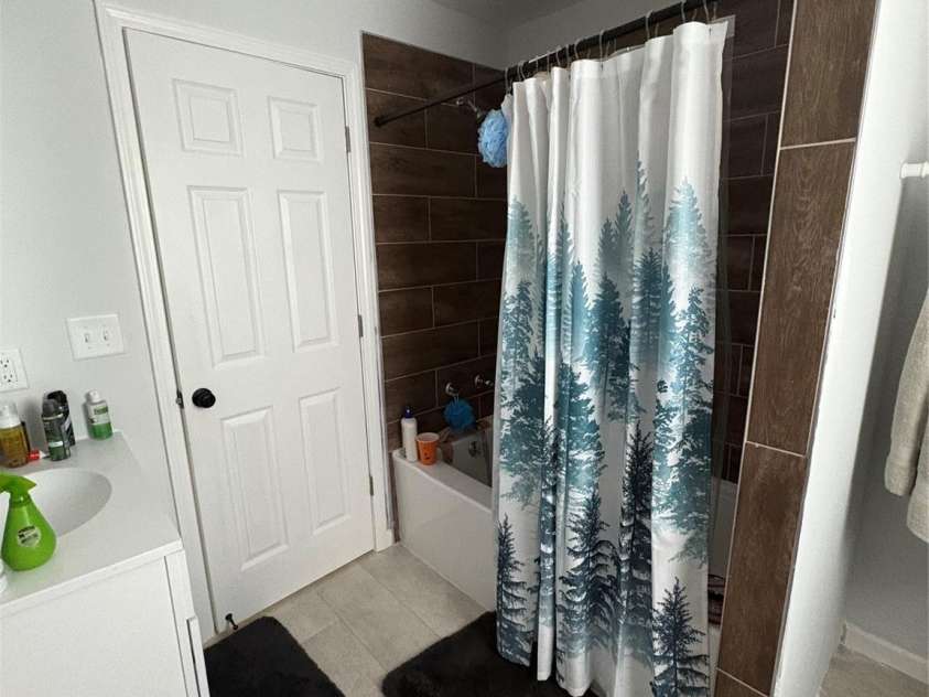 911 Plyler Street, Monroe, NC 28110.  MLS# CAR4356393, YatesRealty ID 21507. Hall Bathroom