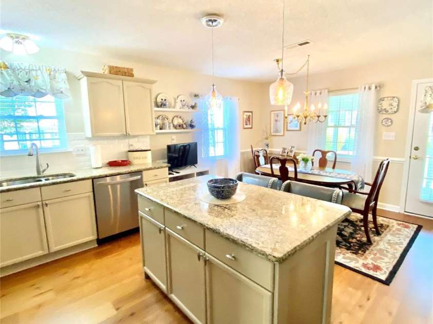 101 Keswick Lane, Mooresville, NC 28117.  MLS# CAR4251834, YatesRealty ID 21518. Kitchen into Dining Area with floating shelves.