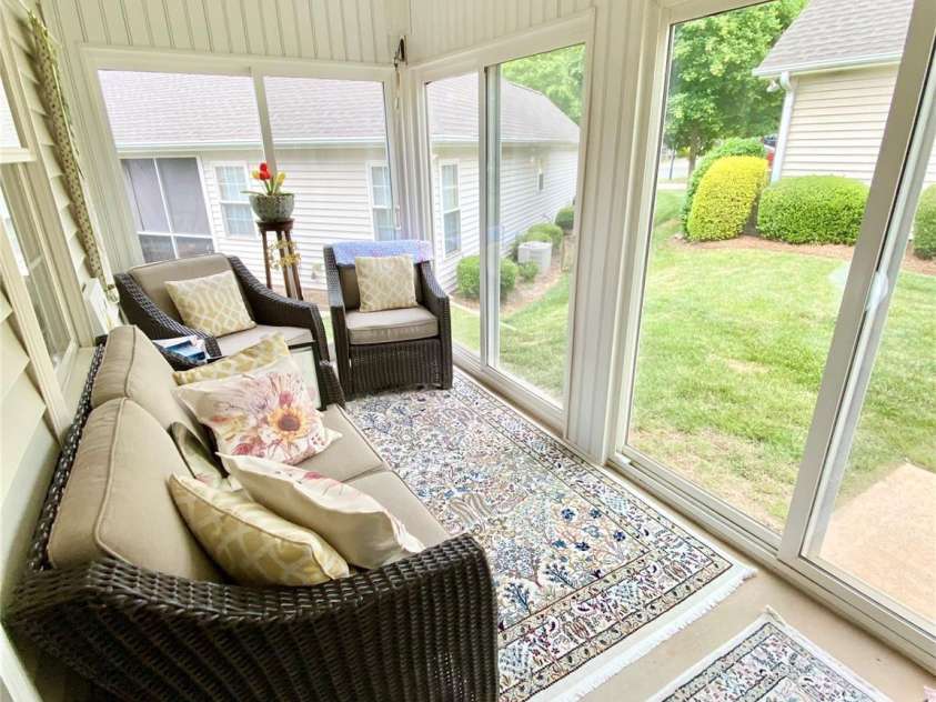 101 Keswick Lane, Mooresville, NC 28117.  MLS# CAR4317962, YatesRealty ID 21518. Pleasant Sunroom to enjoy with lots of windows/sliders for natural light. 