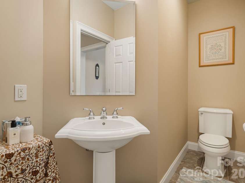 405 Mistletoe Trail, Hendersonville, NC 28791.  MLS# CAR4349682, YatesRealty ID 21518. Main level 1/2 bath
