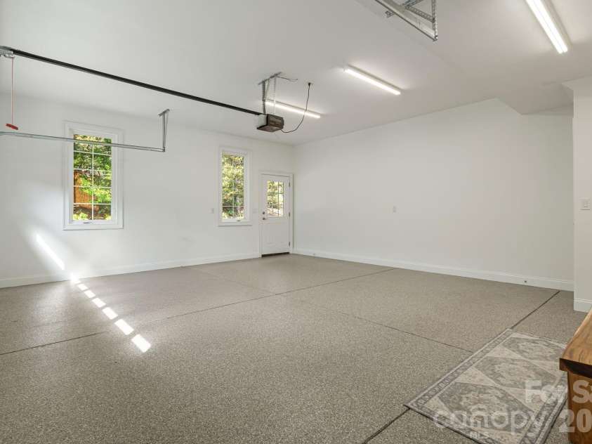 405 Mistletoe Trail, Hendersonville, NC 28791.  MLS# CAR4349682, YatesRealty ID 21518. Main level garage w/ epoxy floor