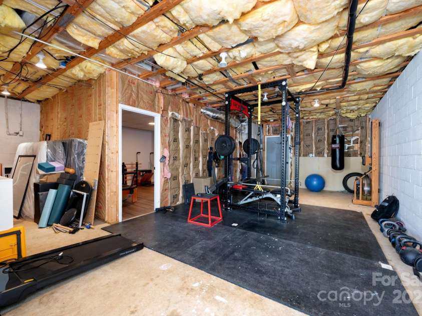 44 White Thorn Drive, Alexander, NC 28701.  MLS# CAR4253765, YatesRealty ID 21522. Attached Tandem Garage in Basement