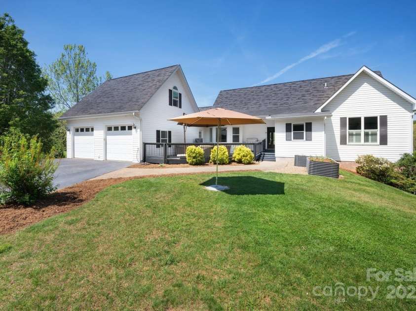 44 White Thorn Drive, Alexander, NC 28701.  MLS# CAR4253765, YatesRealty ID 21522. Back of Property with 2 car garage and outdoor space