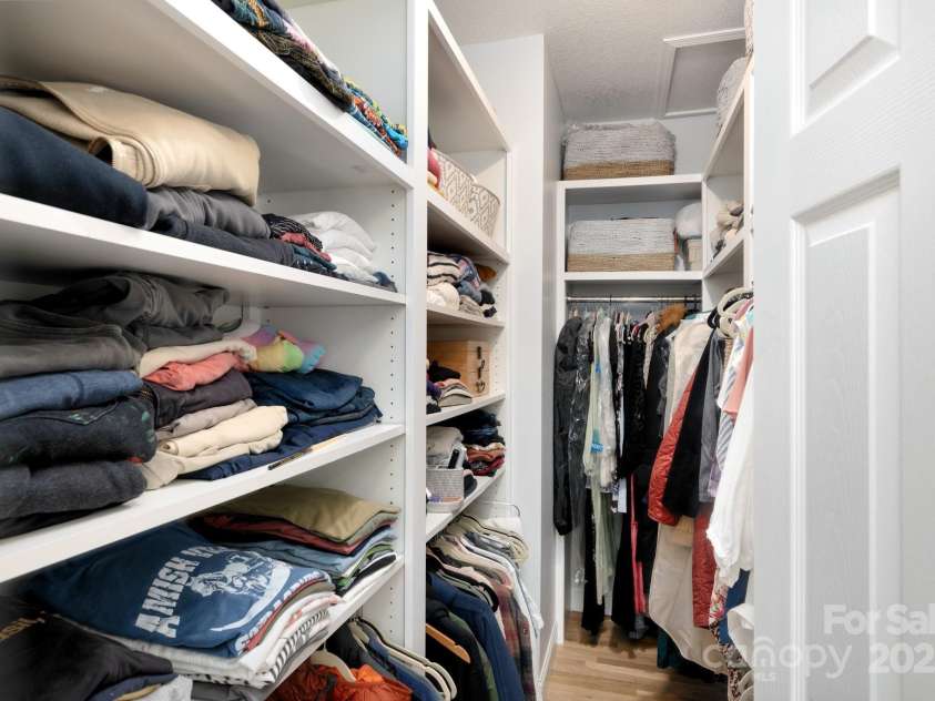 44 White Thorn Drive, Alexander, NC 28701.  MLS# CAR4253765, YatesRealty ID 21522. Primary closet with built ins