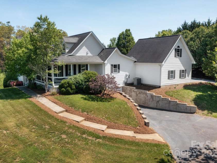 44 White Thorn Drive, Alexander, NC 28701.  MLS# CAR4253765, YatesRealty ID 21522. Side View with Front Walk and Lower Garage