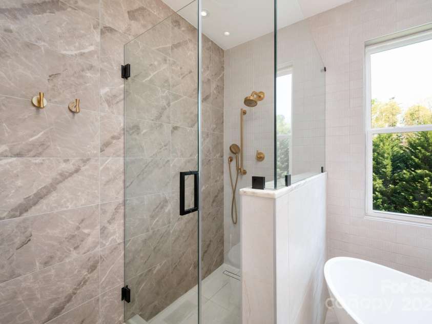 44 White Thorn Drive, Alexander, NC 28701.  MLS# CAR4253765, YatesRealty ID 21522. Step in Shower with Beuatiful Tile