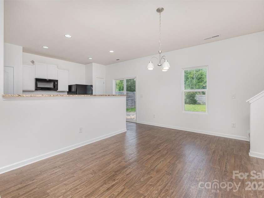 1404 Waylon Avenue, Gastonia, NC 28054.  MLS# CAR4271419, YatesRealty ID 21528. Dining area flows seamlessly from living to kitchen.