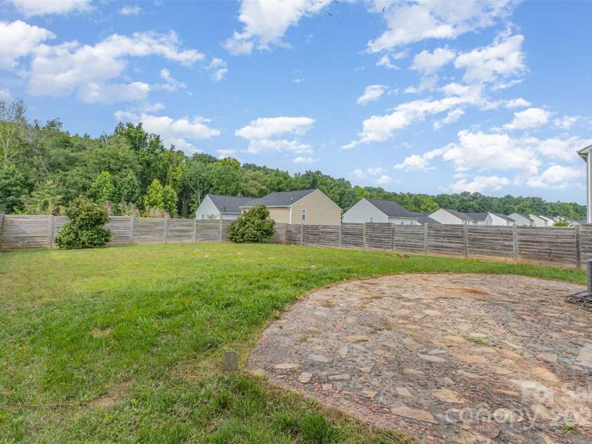 1404 Waylon Avenue, Gastonia, NC 28054.  MLS# CAR4271419, YatesRealty ID 21528. Large yard w patio & privacy fence is ready for your imagination