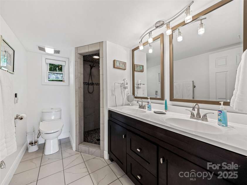 170 Twin Springs Road, Hendersonville, NC 28792.  MLS# CAR4273179, YatesRealty ID 21536. Lower level bath