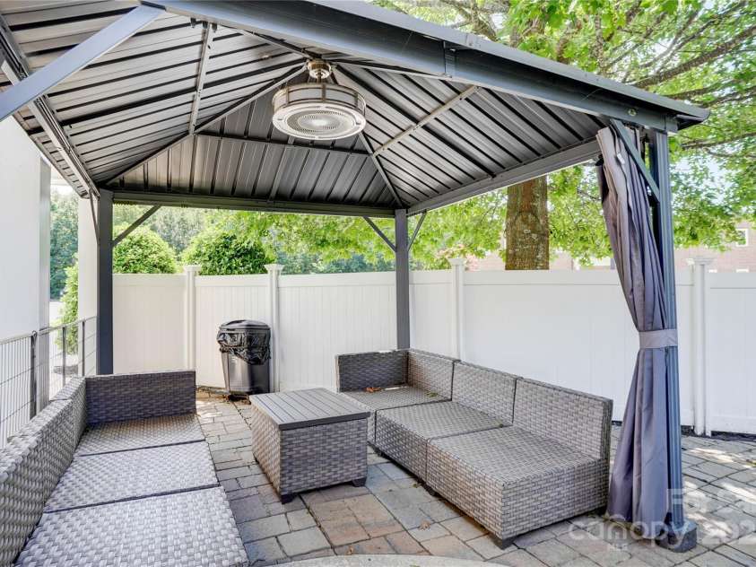 216 Harrison Lane, Locust, NC 28097.  MLS# CAR4244382, YatesRealty ID 21537. 2nd gazebo with furniture