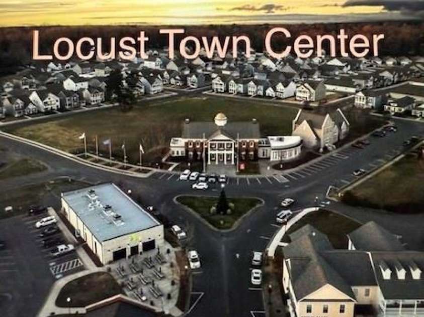 216 Harrison Lane, Locust, NC 28097.  MLS# CAR4244382, YatesRealty ID 21537. Aerial view Locust Town Center