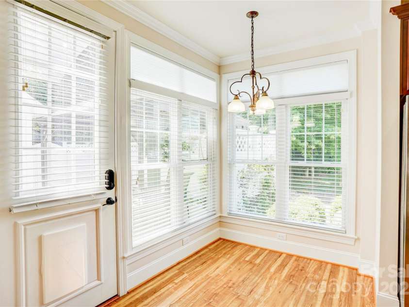 216 Harrison Lane, Locust, NC 28097.  MLS# CAR4244382, YatesRealty ID 21537. Breakfast area overlooking patio