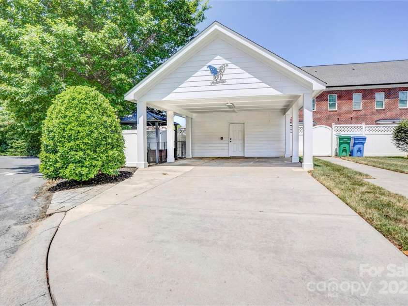 216 Harrison Lane, Locust, NC 28097.  MLS# CAR4244382, YatesRealty ID 21537. Carport & garage