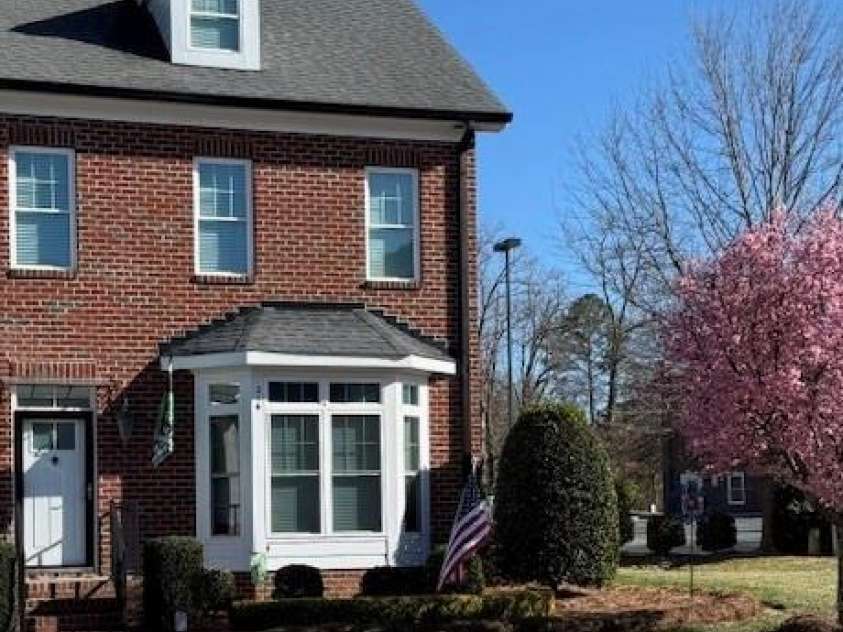 216 Harrison Lane, Locust, NC 28097.  MLS# CAR4244382, YatesRealty ID 21537. End unit with patio and flower garden