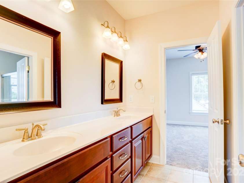 216 Harrison Lane, Locust, NC 28097.  MLS# CAR4244382, YatesRealty ID 21537. Jack & Jill bathroom upstairs