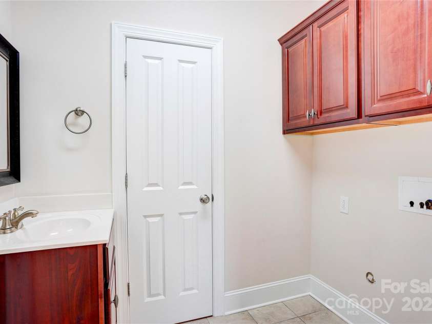 216 Harrison Lane, Locust, NC 28097.  MLS# CAR4244382, YatesRealty ID 21537. Laundry room