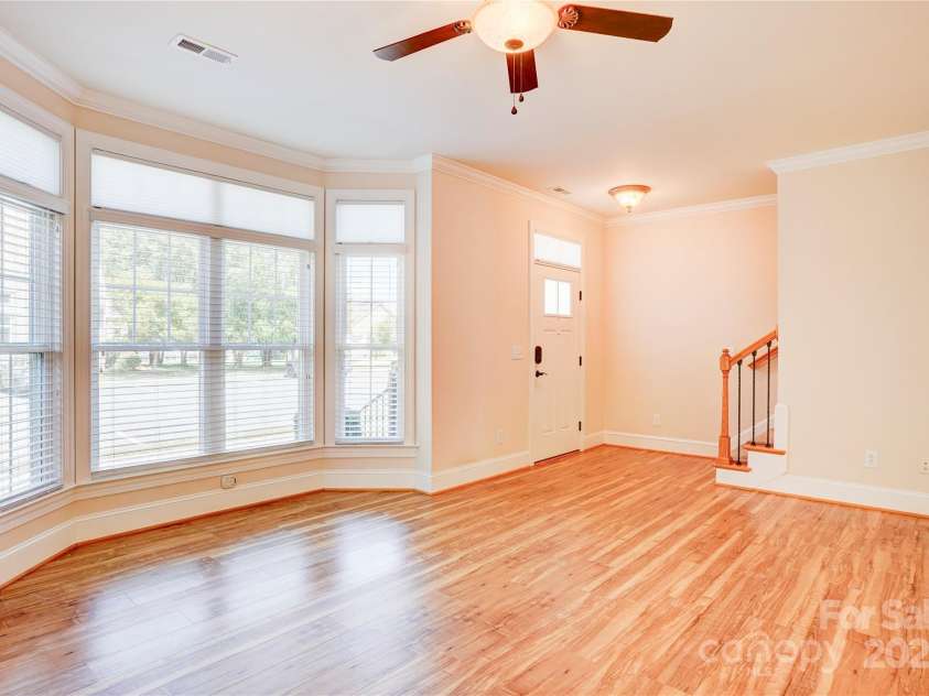 216 Harrison Lane, Locust, NC 28097.  MLS# CAR4244382, YatesRealty ID 21537. Living room