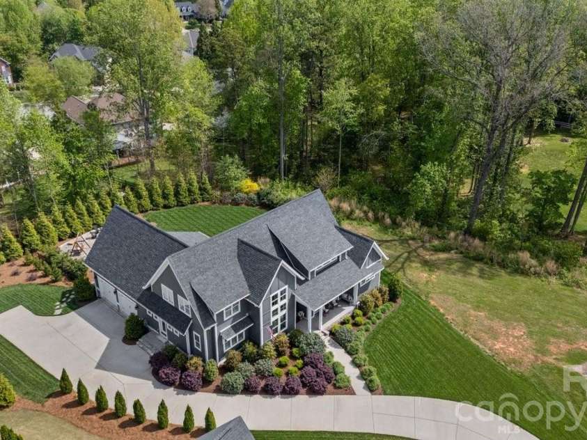 144 Mcneil Lane, Mooresville, NC 28117.  MLS# CAR4366466, YatesRealty ID 21538. Check out this yard with extended parking area. 