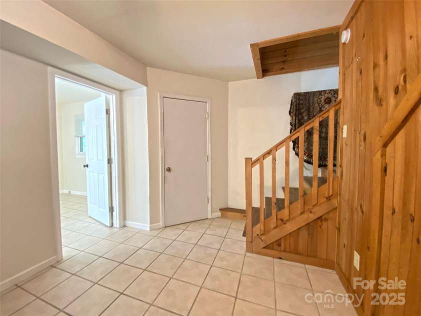 59 Shand Street, Saluda, NC 28773.  MLS# CAR4259487, YatesRealty ID 21538. Apartment-Half Bath beside stairs