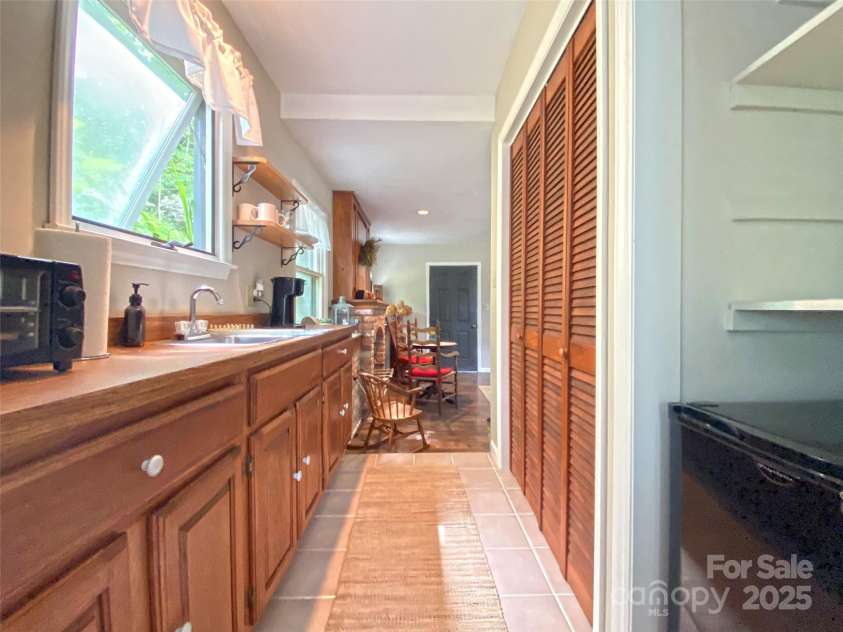 59 Shand Street, Saluda, NC 28773.  MLS# CAR4259487, YatesRealty ID 21538. Cottage-Kitchenette