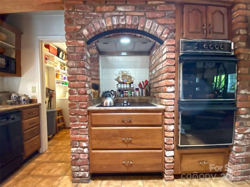 59 Shand Street, Saluda, NC 28773.  MLS# CAR4259487, YatesRealty ID 21538. Main House Kitchen, Laundry Room