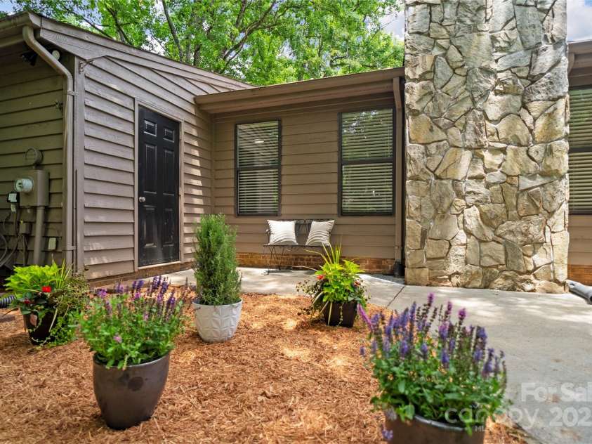 407 Sweetgum Drive, Fort Mill, SC 29715.  MLS# CAR4272607, YatesRealty ID 21552. Fresh cedar chips to enjoy your backyard oasis