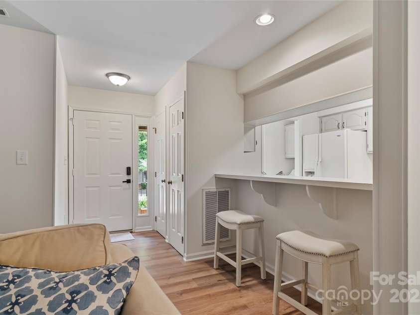 407 Sweetgum Drive, Fort Mill, SC 29715.  MLS# CAR4272607, YatesRealty ID 21552. Painted from top to bottom & new LVP flooring welcome you into this end-unit condo