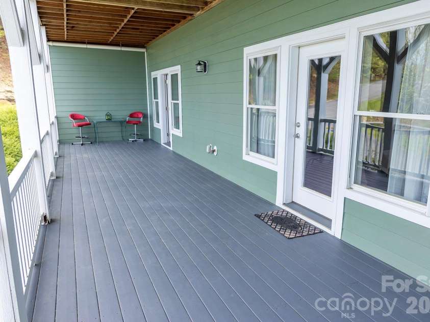 5 Gemini Heights, Weaverville, NC 28787.  MLS# CAR4341848, YatesRealty ID 21565. Lexpansive lower porch/deck