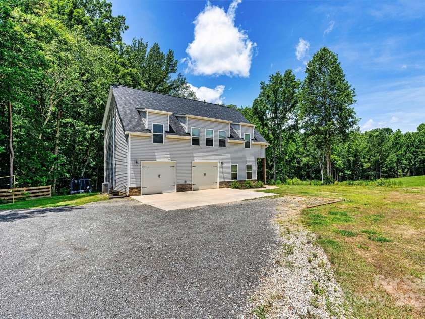237 Mariposa Road, Stanley, NC 28164.  MLS# CAR4272727, YatesRealty ID 21573. House sits far from the street. Plenty of parking and 2+ gargae