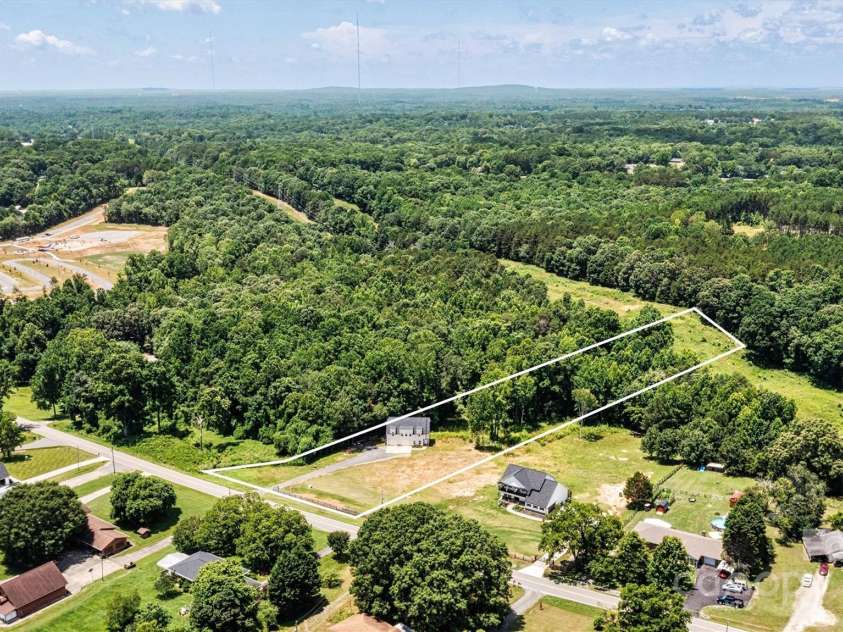 237 Mariposa Road, Stanley, NC 28164.  MLS# CAR4272727, YatesRealty ID 21573. Plenty of space to bring your animals, build your dream home or enjoy country living on this lot.