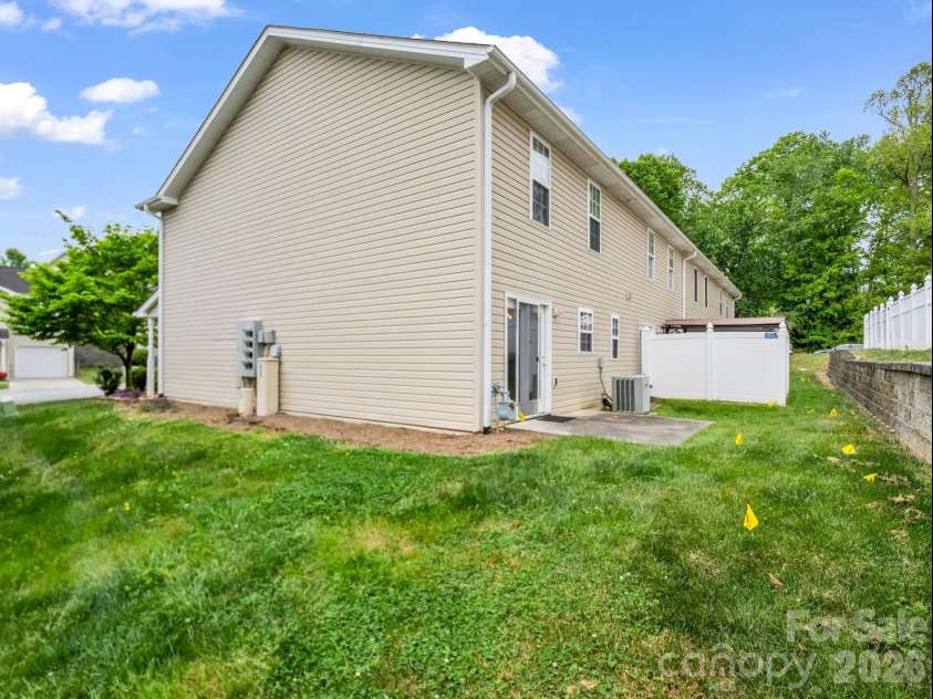 64 Lanceford Circle, Fletcher, NC 28732.  MLS# CAR4374412, YatesRealty ID 21576. Back and side yards