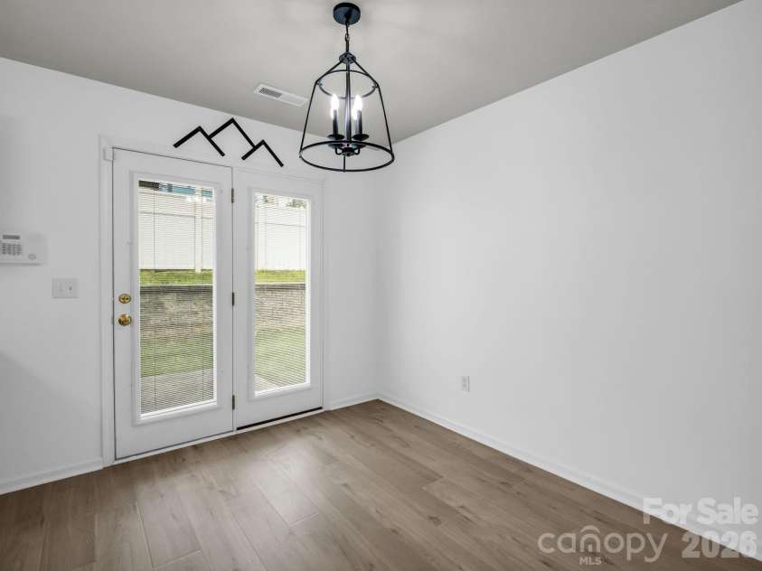 64 Lanceford Circle, Fletcher, NC 28732.  MLS# CAR4374412, YatesRealty ID 21576. Dining Area with door to patio