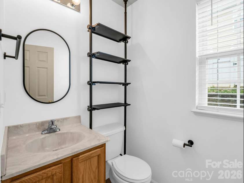 64 Lanceford Circle, Fletcher, NC 28732.  MLS# CAR4374412, YatesRealty ID 21576. Main level 1/2 bath for guests