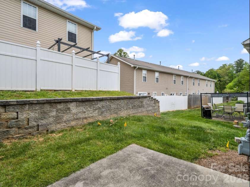 64 Lanceford Circle, Fletcher, NC 28732.  MLS# CAR4374412, YatesRealty ID 21576. Patio and backyard