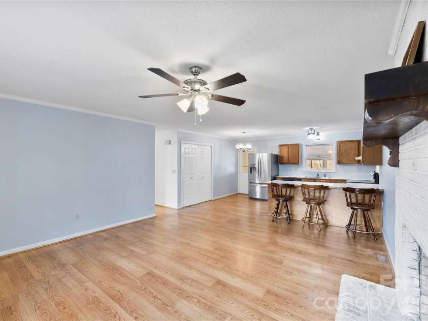 213 Woodrun Drive, Mount Gilead, NC 27306.  MLS# CAR4334949, YatesRealty ID 2158. A bright, open living and kitchen layout made for effortless entertaining after days spent on the lake and sunsets at the dock.