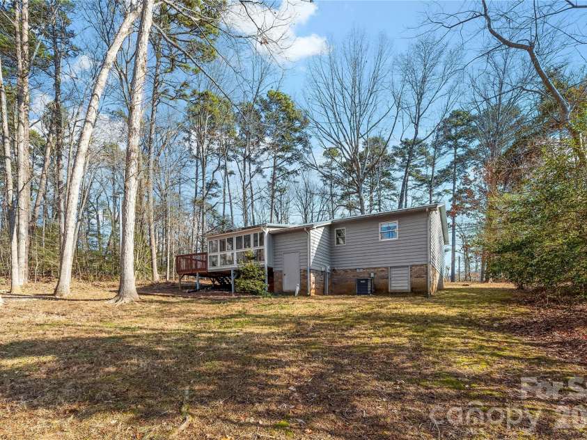 213 Woodrun Drive, Mount Gilead, NC 27306.  MLS# CAR4334949, YatesRealty ID 2158. A calm rear exterior setting designed for grilling, lounging, and easy outdoor enjoyment.