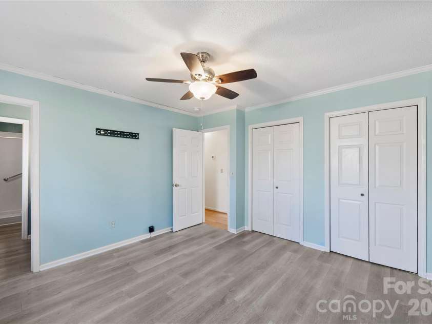 213 Woodrun Drive, Mount Gilead, NC 27306.  MLS# CAR4334949, YatesRealty ID 2158. A calming primary bedroom retreat with an ensuite bath and double closets, designed for rest, reset, and relaxed mornings.